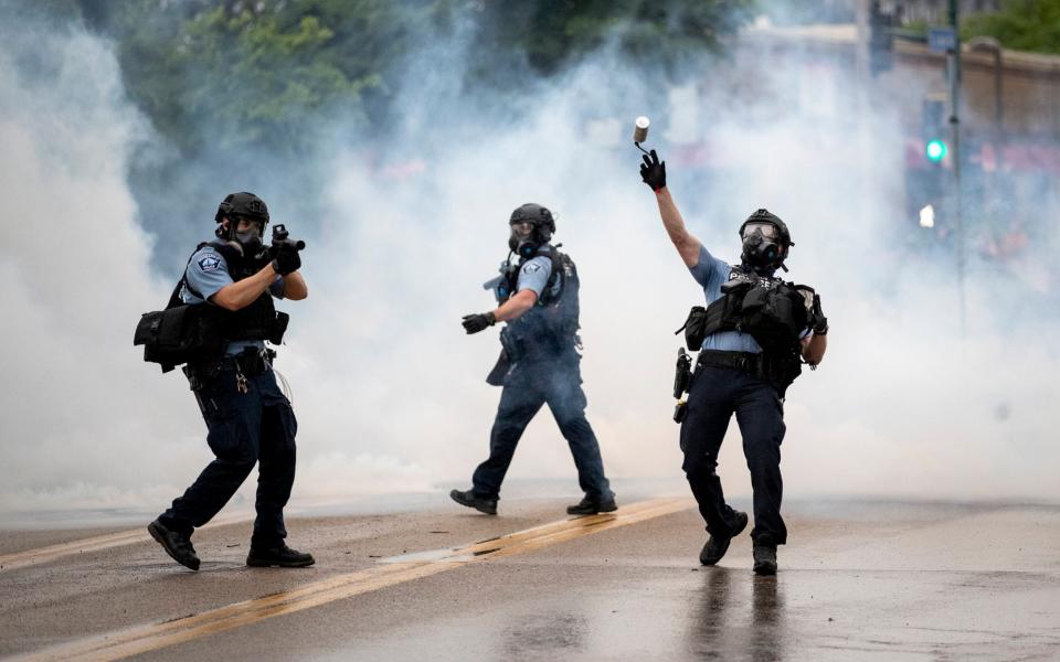 Police took on the protesters with stun grenades and tear gas - Carlos Gonzalez/AP