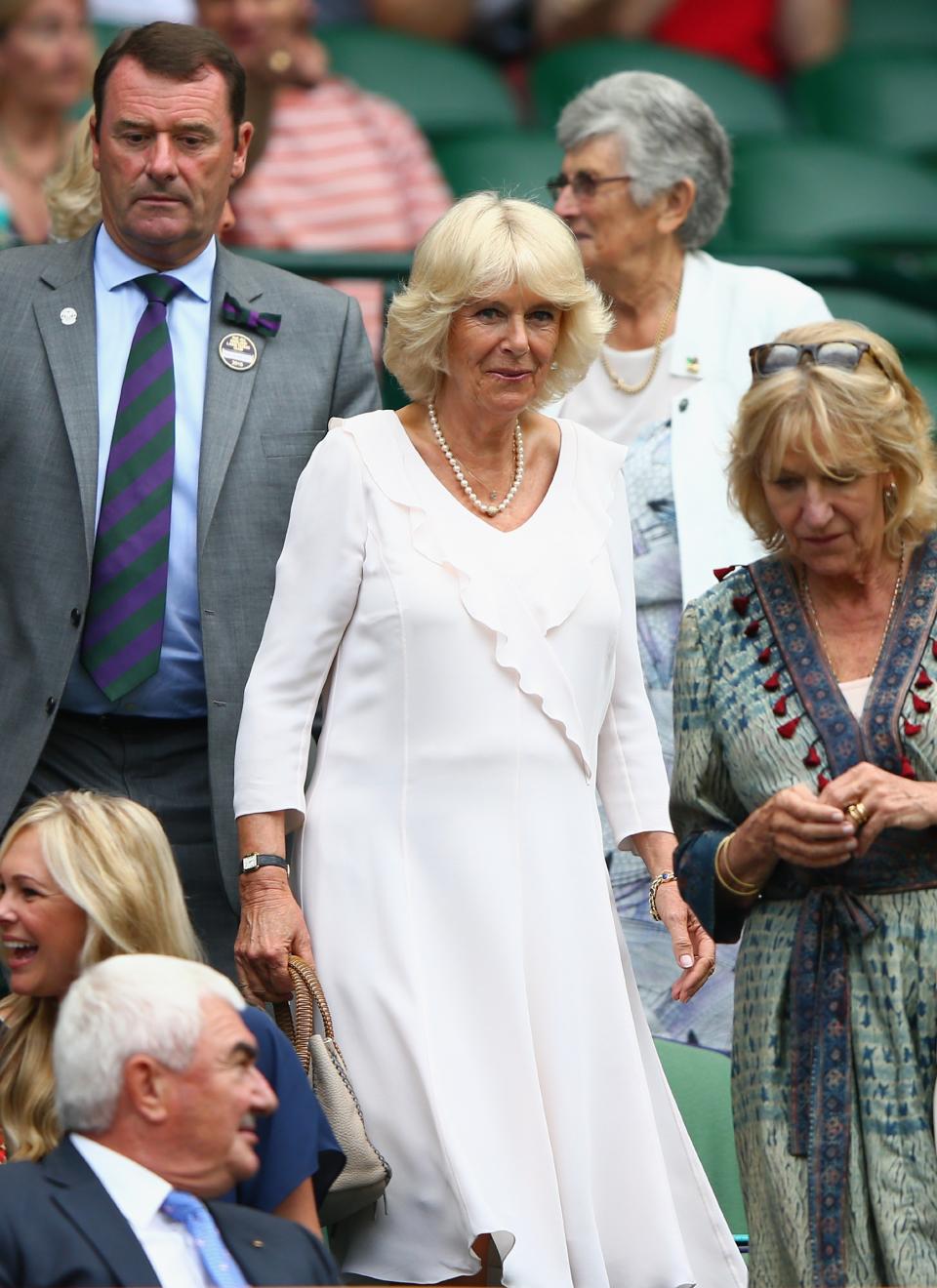 LONDON, ENGLAND - JULY 02: (L-R) Camilla, Duchess of Cornwall (C) arrives on Centre Court during day four of the Wimbledon Lawn Tennis Championships at the All England Lawn Tennis and Croquet Club on July 2, 2015 in London, England. (Photo by Ian Walton/Getty Images)