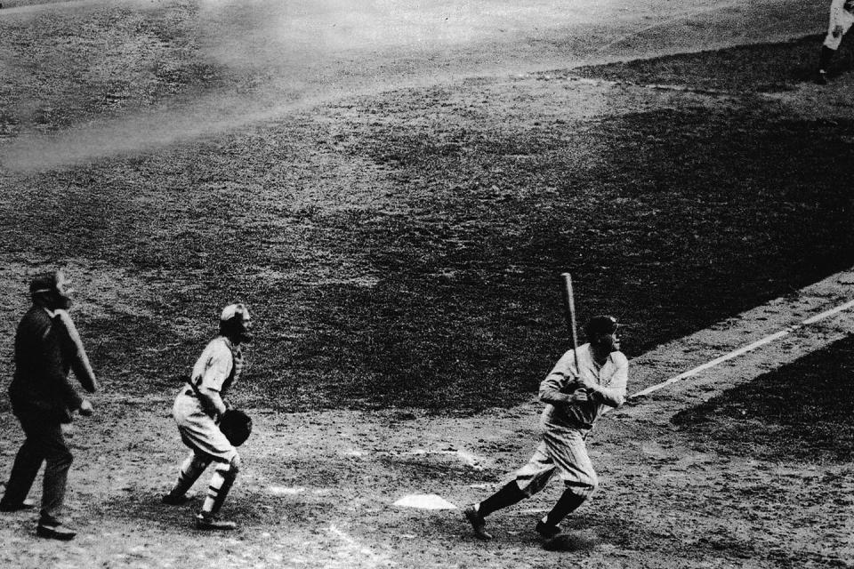 <p>Babe Ruth makes his 60th home run of the 1927 season at Yankee Stadium, a record that would remain unbroken for the next 34 years.</p>