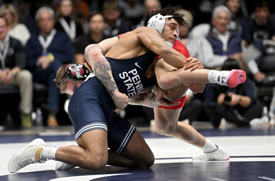 Penn State’s Carter Starocci wrestles Ohio State’s Rocco Welsh on 174 lb bout during the match on Friday, Feb. 2, 2024 in Rec Hall.