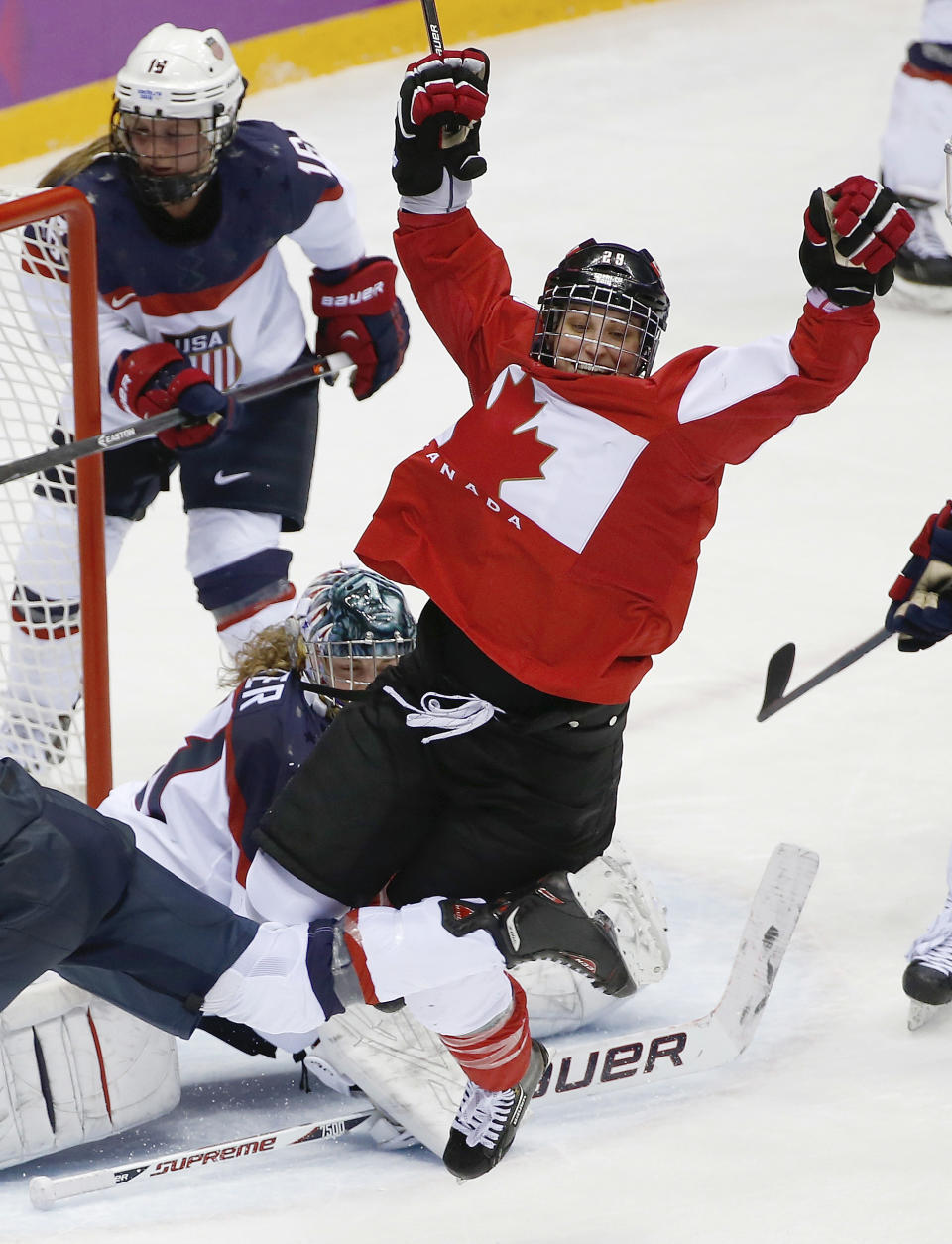 Marie-Philip Poulin of Canada, right, celebrates her goal against the United States in the third period of the women's gold medal ice hockey game at the 2014 Winter Olympics, Thursday, Feb. 20, 2014, in Sochi, Russia. (AP Photo/Petr David Josek, File)