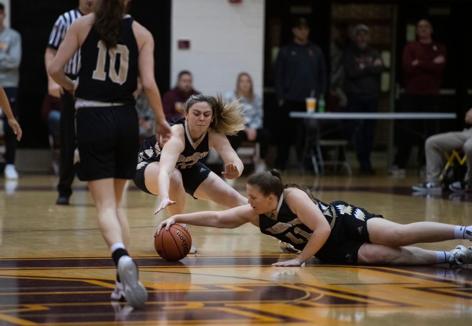 Washington’s Hayleigh Cummins (41) dives for the ball as the Gibson Southern Lady Titans play the Washington Lady Hatchets Saturday, Jan. 13, 2024.