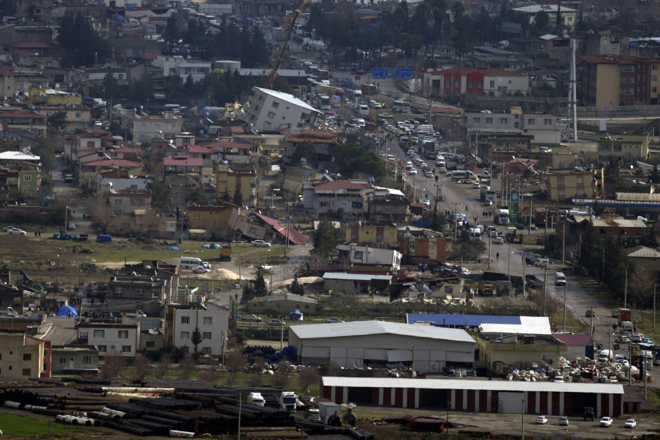 <p>A top view shows destroyed buildings in Nurdagi town on the outskirts of Osmaniye city southern Turkey, Tuesday, Feb. 7, 2023. A powerful earthquake hit southeast Turkey and Syria early Monday, toppling hundreds of buildings and killing and injuring thousands of people. (AP Photo/Khalil Hamra)</p> 