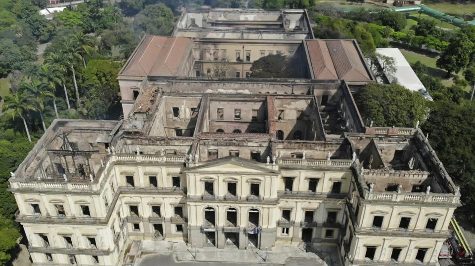 FILE - In this Sept. 3, 2018 file photo, the National Museum stands gutted after an overnight fire in Rio de Janeiro, Brazil. The National Museum had authenticity in spades. Its colonial-era building was the backdrop to much of Brazil's history, a onetime royal palace that served as the seat of the united Portuguese and Brazilian empire before the museum's collection was transferred there in 1892. (AP Photo/Mario Lobao, File)