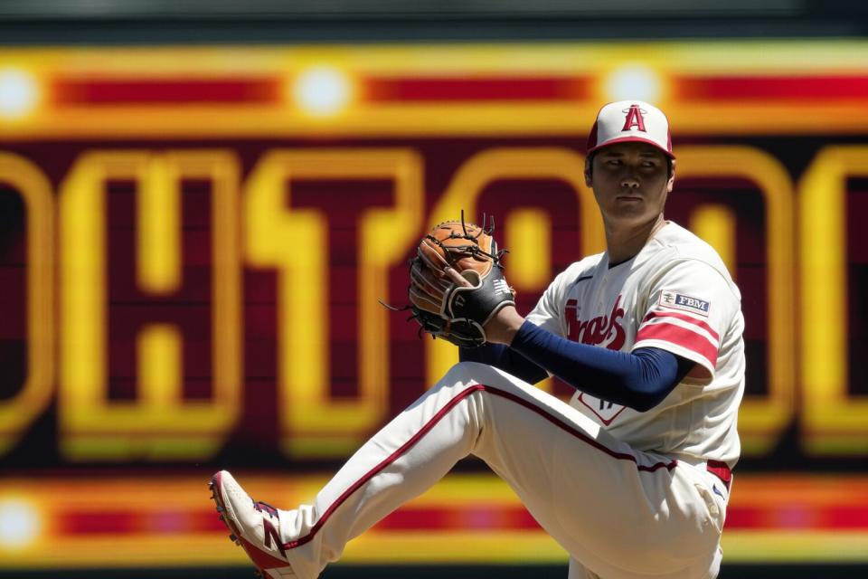 Angels starting pitcher Shohei Ohtani warms up before Wednesday's game against the Cincinnati Reds.