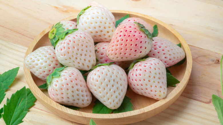 PIneberries on a wooden bowl