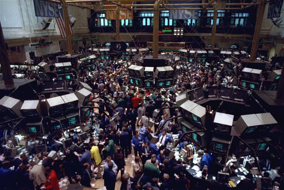 The New York Stock Exchange trading floor is jammed with traders in this October 19, 1987 file photo as stocks plunged in the biggest one-day selloff in history. (AP Photo/Peter Morgan)