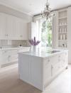 <p>Shaker style cabinetry, with unexpected silver rather than the classic gold or brass hardware, a smattering of pure white accessories, and a feature chandelier is all that is needed to create a quietly opulent white kitchen. </p><p>Pictured: <a href="https://mowlemandco.com/?project=grace" rel="nofollow noopener" target="_blank" data-ylk="slk:Grace Kitchen at Mowlem & Co;elm:context_link;itc:0;sec:content-canvas" class="link ">Grace Kitchen at Mowlem & Co</a></p>