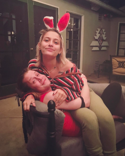 <p>For all intents and purposes, these two are family, so it makes sense they celebrate holidays together — or holiday <em>weeks</em>. A few days after Easter last month, she shared this pic, in which she was rocking bunny ears and sitting on the <em>Party Monster</em> star’s lap. (Photo: Paris Jackson via <a rel="nofollow noopener" href="https://www.instagram.com/p/BTJHPe1hhUR/" target="_blank" data-ylk="slk:Instagram;elm:context_link;itc:0;sec:content-canvas" class="link ">Instagram</a>) </p>