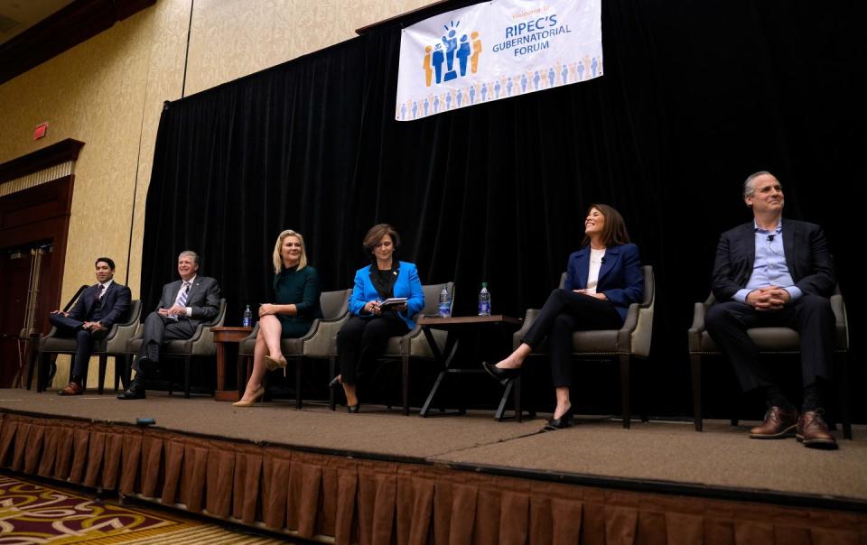 From left, Dr. Luis Daniel Muñoz, Gov. Dan McKee, Ashley Kalus, Secretary of State Nellie Gorbea, Helena Foulkes and Matt Brown  before the start of Thursday's Governors Forum at the Crowne Plaza in Warwick.