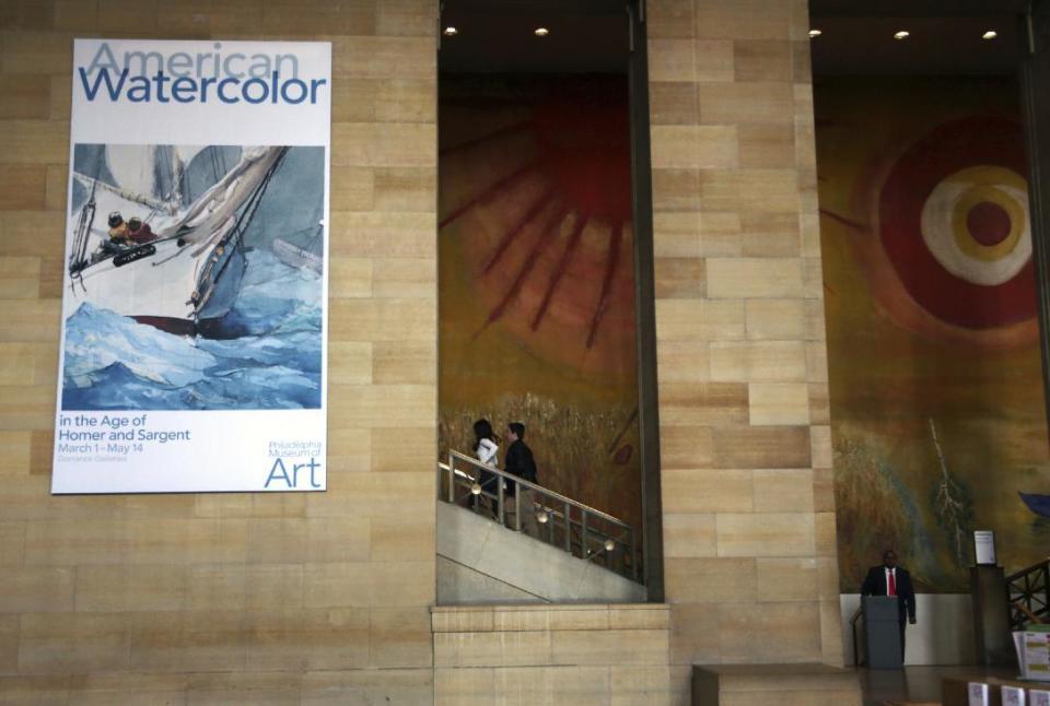 In this Tuesday Feb. 21, 2017 photo, a banner advertises an upcoming exhibition at the Philadelphia Museum of Art in Philadelphia. "American Watercolor in the Age of Homer and Sargent" will be on view from March 1 to May 14, 2017, bringing together masterpieces drawn from public and private collections throughout the county, and will be shown only in Philadelphia. (AP Photo/Jacqueline Larma)