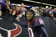 FILE - In this Jan. 4, 2020, file photo, Houston Texans wide receiver DeAndre Hopkins celebrates with fans after an NFL wild-card playoff football game against the Buffalo Bills in Houston. The Arizona Cardinals have acquired three-time All-Pro receiver DeAndre Hopkins in a trade that will send running back David Johnson and draft picks to the Houston Texans, a person familiar with the situation told The Associated Press. The person spoke to the AP on condition of anonymity Monday, March 16, 2020, because the trade hasn't been officially announced. (AP Photo/Michael Wyke)