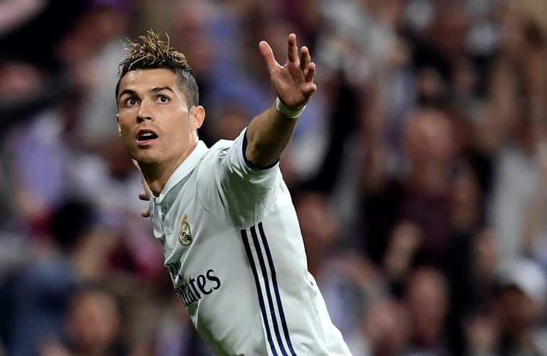Real Madrid's Cristiano Ronaldo celebrates after scoring against Atletico Madrid during their Champions League match at the Santiago Bernabeu stadium on May 2, 2017