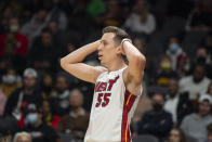 Miami Heat guard Duncan Robinson (55) reacts after a foul during the first half of an NBA basketball game against the Atlanta Hawks, Friday, Jan. 21, 2022, in Atlanta. (AP Photo/Hakim Wright Sr.)