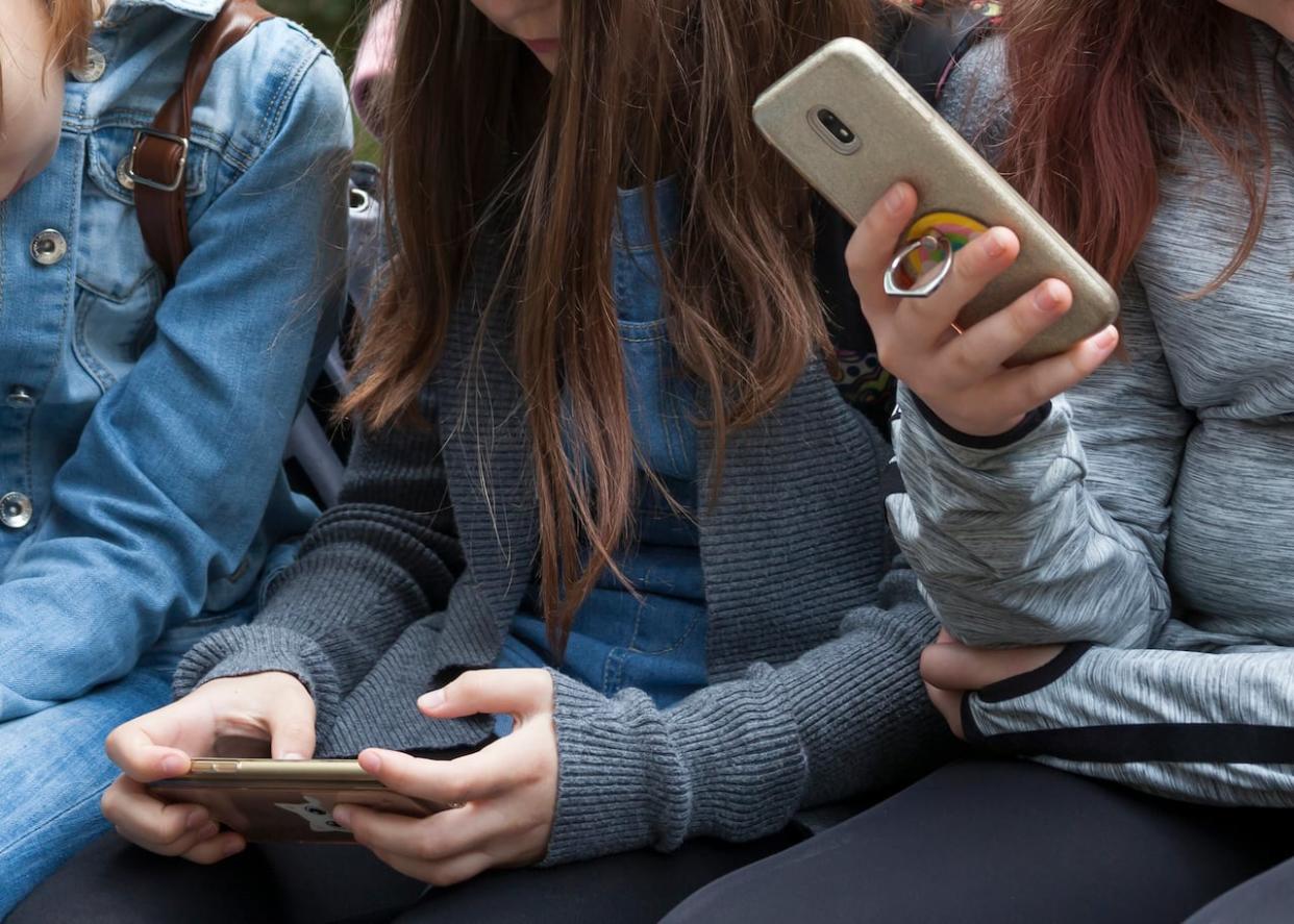 As concerns grow about the use of smartphones by children and teens, members of the first generation who grew up with a cellphone say we should all be worried about what's happening on social media. (Shutterstock / tomeqs - image credit)