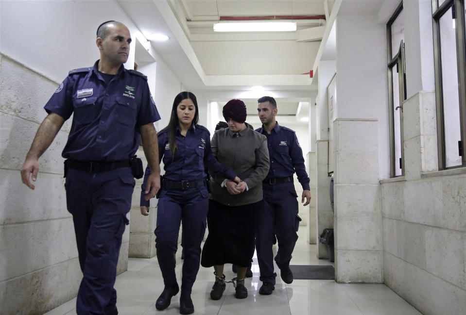 FILE - Australian Malka Leifer is brought to a courtroom in Jerusalem on Feb. 27, 2018. Leifer, a former principal of a Jewish girls school, was found guilty Monday, April 3, 2023, of sexually abusing two students. (AP Photo/Mahmoud Illean, File)