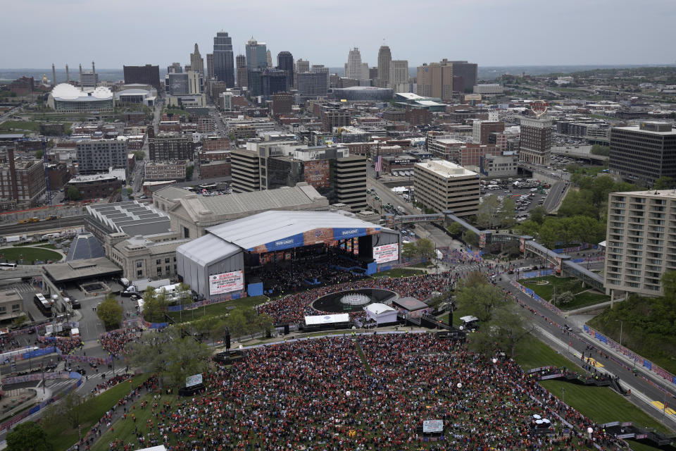 Fans gather before the first round of the NFL football draft, Thursday, April 27, 2023, in Kansas City, Mo. (AP Photo/Charlie Riedel)