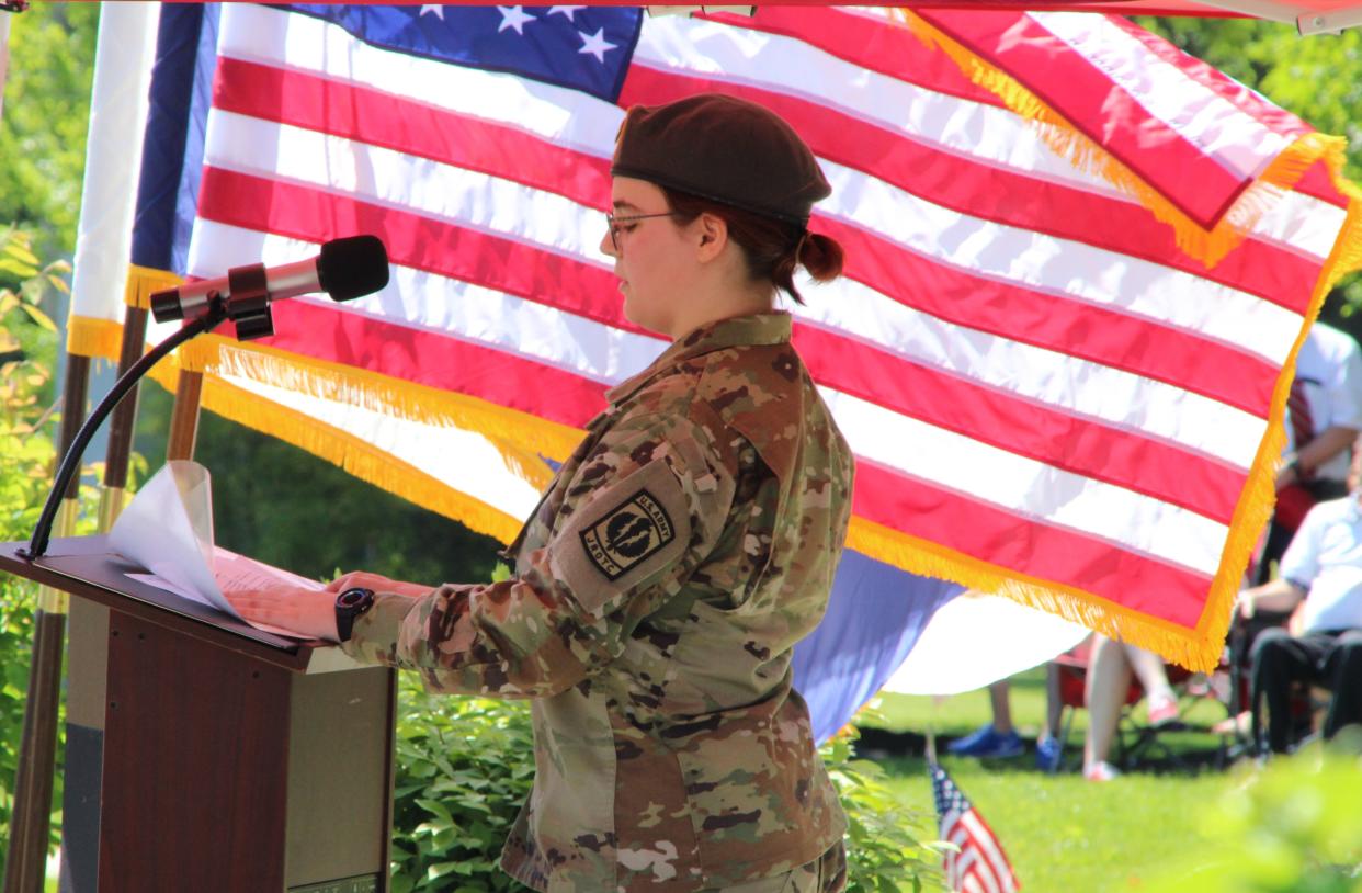 Cadet Elizabeth Simons of the Marion Harding High School Junior ROTC reads about the history of "Taps" during the Memorial Day ceremony held Monday, May 29, 2023, at Veterans Memorial Park in Marion. The Junior ROTC posted and retired the colors during the ceremony and Cadet Ethan Baker read the poem "Flanders Fields" to crowd gathered at Veterans Memorial Park. The Memorial and Veterans Day Association of Marion County organized the event.
