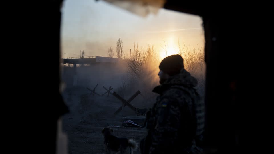 A Ukrainian soldier is seen during sunset in the village of Karlivka, near the Avdiivka frontline. - Narciso Contreras/Anadolu/Getty Images