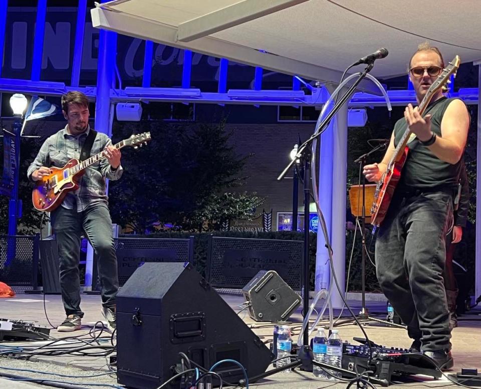 Joe Vitale Jr., right, performs on Friday night at Centennial Plaza during the second and final day of the Downtown Canton Music Fest.