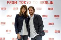 German model Eva Padberg and German Actor Daniel Bruehl pose in the Uniqlo Global flagship store during a preopening in Berlin, April 10, 2014. REUTERS/Axel Schmidt