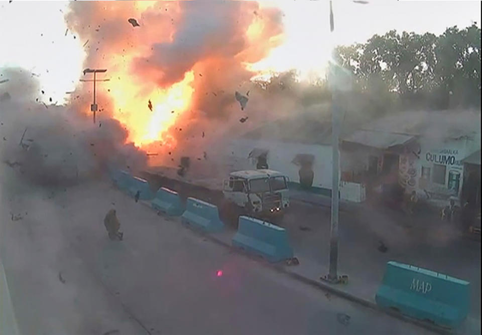 <p>A video grab taken from a Somali police CCTV, date shot May 24, 2017, shows the moment a car explodes near the Mogadishu seaport in Somalia. (Photo: Somali Police/Reuters) </p>