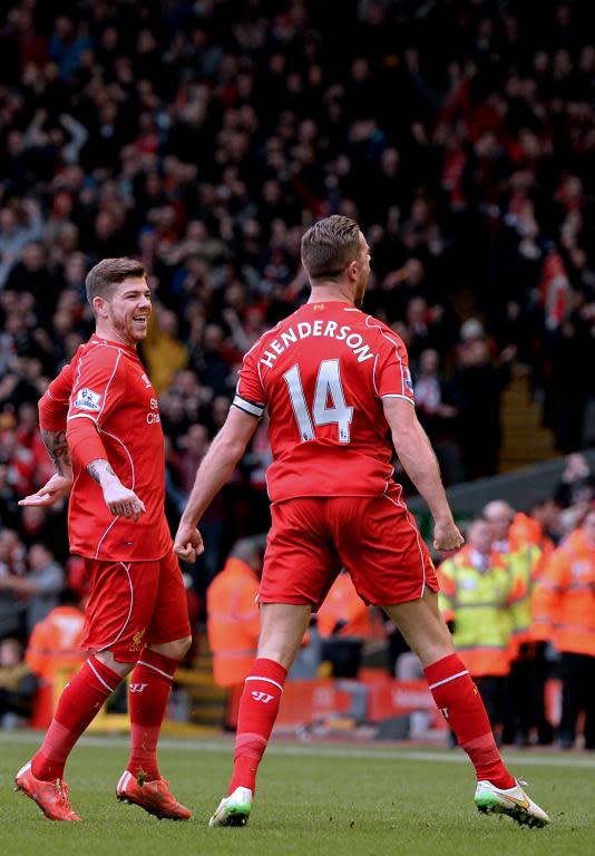 Liverpool's Jordan Henderson (R) celebrates scoring their first goal in their 2-1 win against Manchester City at Anfield on March 1, 2015