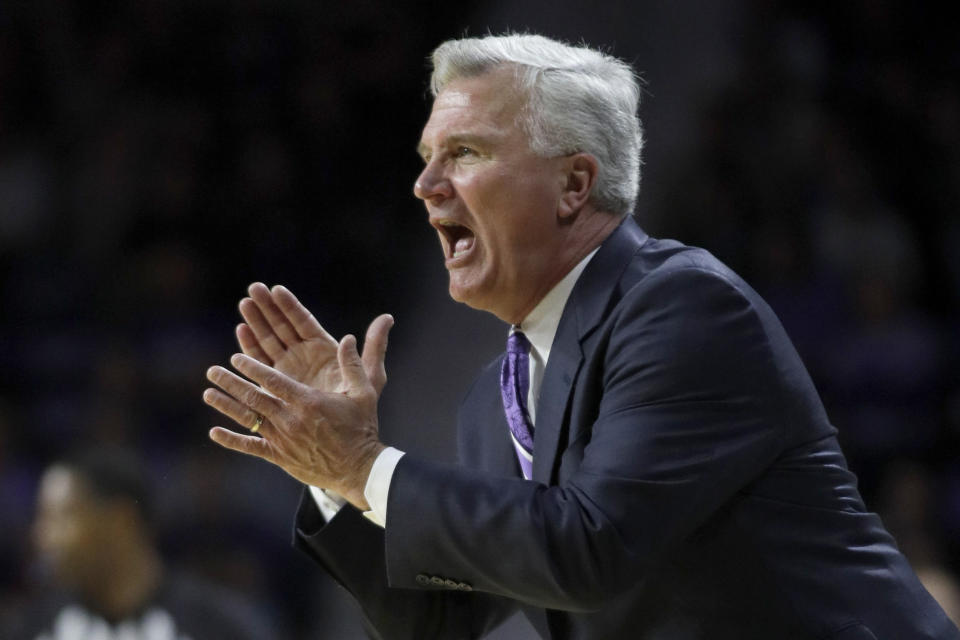 Kansas State head coach Bruce Weber applauds his team during the first half of an NCAA college basketball game against Texas in Manhattan, Kan., Saturday, Feb. 22, 2020. (AP Photo/Orlin Wagner)