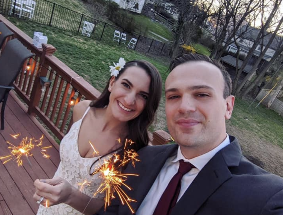 Lauren and Donnie Thomas got married before virtual guests and neighbors watching from a safe distance. (Photo: Courtesy of Lauren Thomas)