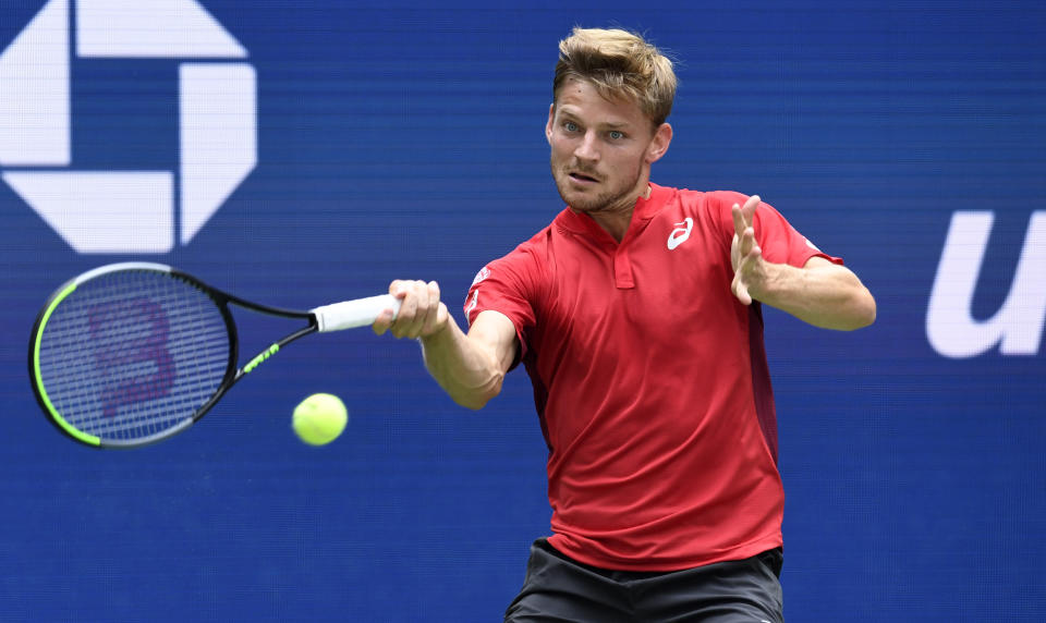 David Goffin, of Belgium, returns to Roger Federer, of Switzerland, during the fourth round of the US Open tennis championships Sunday, Sept. 1, 2019, in New York. (AP Photo/Sarah Stier)