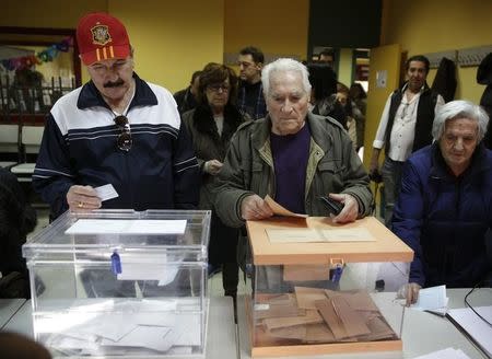 People queue at a polling station during voting in Spain's general election in Madrid, Spain, December 20, 2015. REUTERS/Andrea Comas