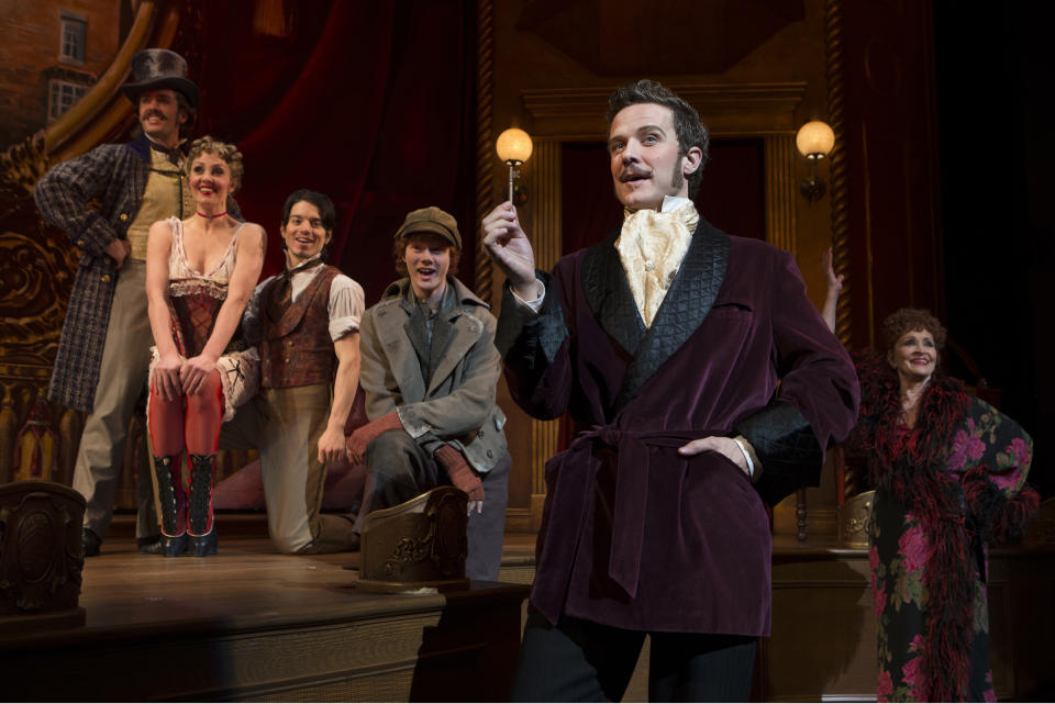 This theater image released by Boneau-Bryan/Brown shows, from left, Eric Sciotto, Shannon Lewis, kyle Coffman, Nicholas Barasch, Will Chase and Chita Rivera in a scene from "The Mystery of Edwin Drood," playing at the Roundabout Theatre Company at Studio 54 in New York. (AP Photo/Boneau-Bryan/Brown, Joan Marcus)