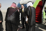 U.S. Secretary of State Mike Pompeo, centre, is greeted by Saudi Foreign Minister Adel al-Jubeir, left, after arriving in Riyadh, Saudi Arabia, Tuesday Oct. 16, 2018. Pompeo arrived Tuesday in Saudi Arabia for talks with King Salman over the unexplained disappearance and alleged slaying of Saudi writer Jamal Khashoggi, who vanished two weeks ago during a visit to the Saudi Consulate in Istanbul.(Leah Millis/Pool via AP)