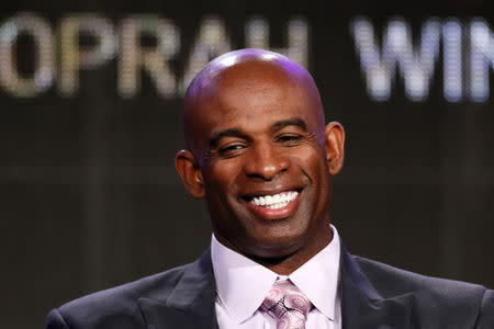 FILE PHOTO: Deion Sanders talks about OWN: Oprah Winfrey Network's "Deion's Family Playbook" during the Winter 2014 TCA presentations in Pasadena, California, January 9, 2014. REUTERS/Lucy Nicholson