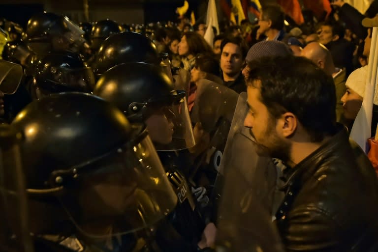 Supporters of Ecuadorean presidential candidate for the CREO party Guillermo Lasso, protest outside the National Electoral Council in Quito, on April 2, 2017