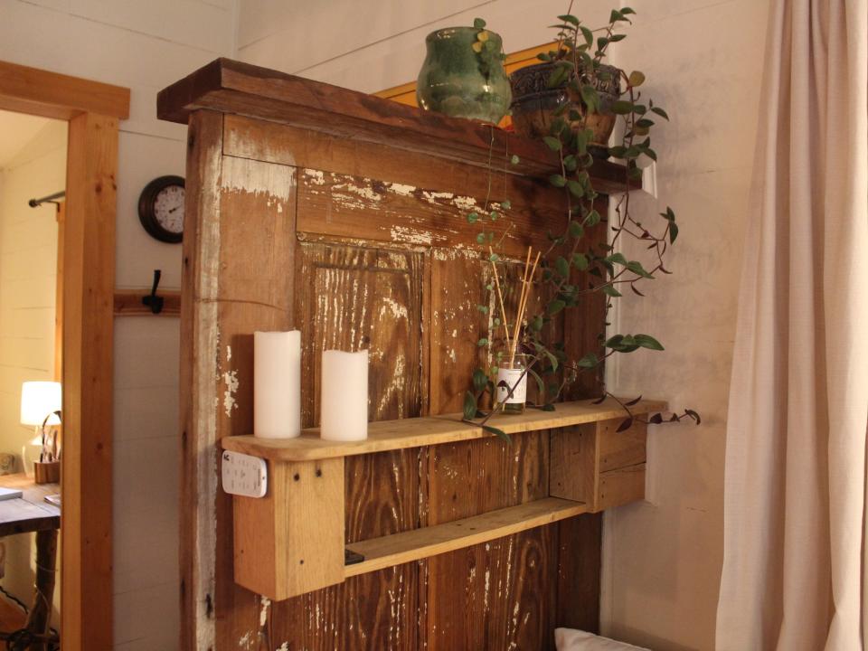 a shelving unit near the day bed