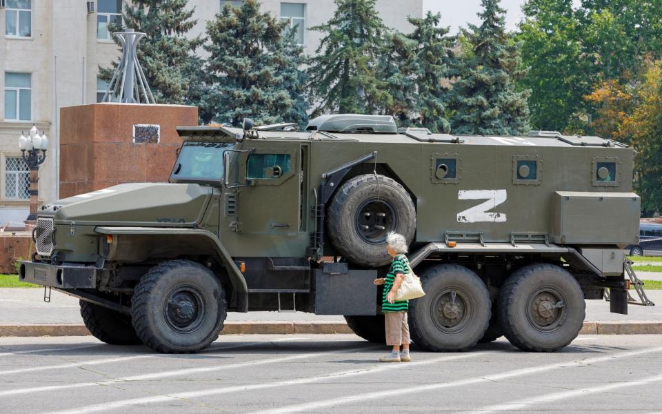 An armoured truck of pro-Russian troops in the Russia-controlled city of Kherson - Reuters