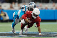 Arizona Cardinals quarterback Kyler Murray is tackled by Carolina Panthers defensive end Brian Burns during the first half of an NFL football game on Sunday, Oct. 2, 2022, in Charlotte, N.C. (AP Photo/Rusty Jones)