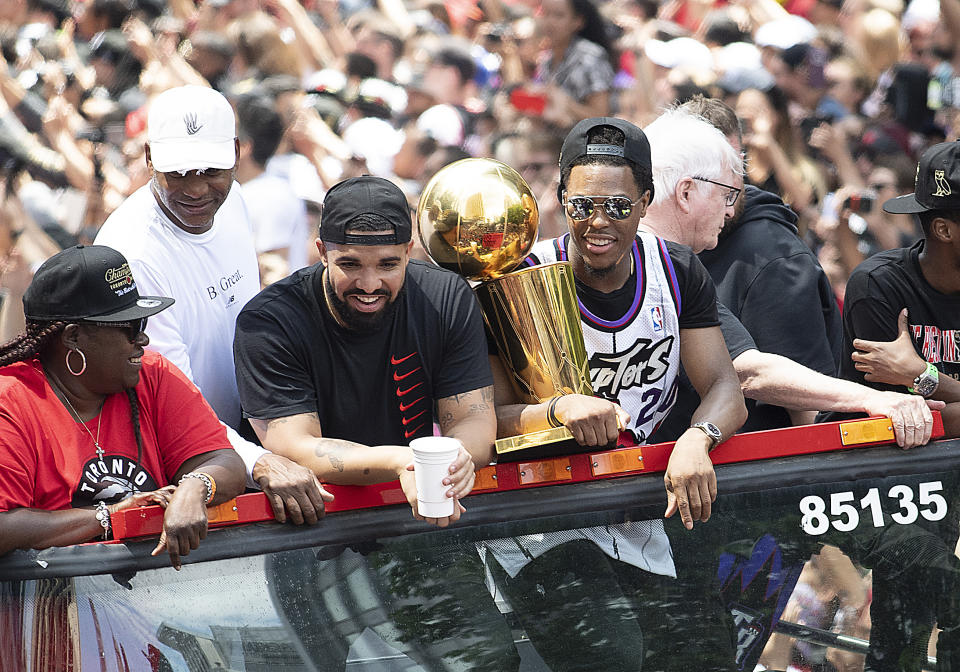 Canadian recording artist Drake sits beside Toronto Raptors guard Kyle Lowry at Toronto Raptors Championship Parade. (Photo by Nick Turchiaro-USA TODAY Sports)