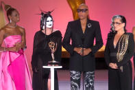 <p>Upon wining outstanding competition program for <em>RuPaul's Drag Race</em>, RuPaul thanked all of his lovely drag children and ended his acceptance speech with encouraging words to those who want to join the <em>Drag Race</em> family.</p> <p>"But really thanks to all of our lovely children on our show from around the world. They are so courageous to tell their stories of courage and how to navigate this difficult life, even more difficult today. This is for you and for you kids out there watching, you have a tribe that is waiting for you," he said. "We are waiting for you, baby. Come on, Mama."</p> <p>This win made <a href="https://people.com/tv/2021-emmy-awards-rupaul-becomes-the-black-performer-with-the-most-emmys/" rel="nofollow noopener" target="_blank" data-ylk="slk:RuPaul the record holder for most Emmys for any Black artist;elm:context_link;itc:0;sec:content-canvas" class="link ">RuPaul the record holder for most Emmys for any Black artist</a> with 11 total.</p>