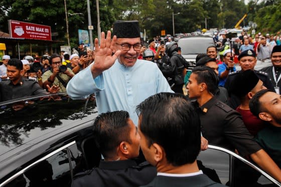 Anwar waves as he leaves after Friday prayers at a mosque in Gombak, outside Kuala Lumpur, Malaysia, on July 14.<span class="copyright">Fazry Ismail—EPA-EFE/Shutterstock </span>