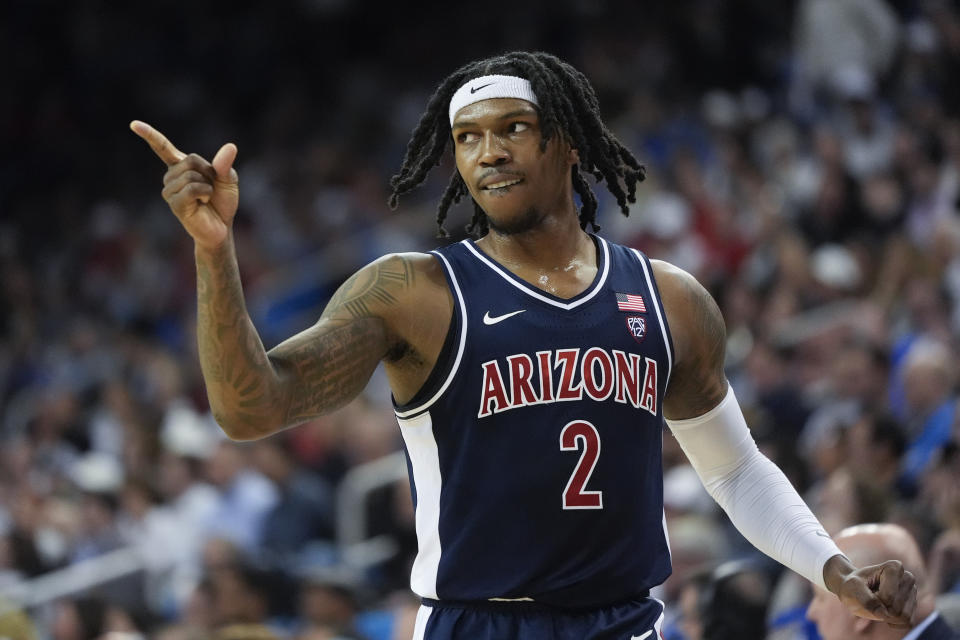 Arizona guard Caleb Love (2) points to a teammate during the first half of an NCAA college basketball game against UCLA in Los Angeles, Thursday, March 7, 2024. (AP Photo/Jae C. Hong)