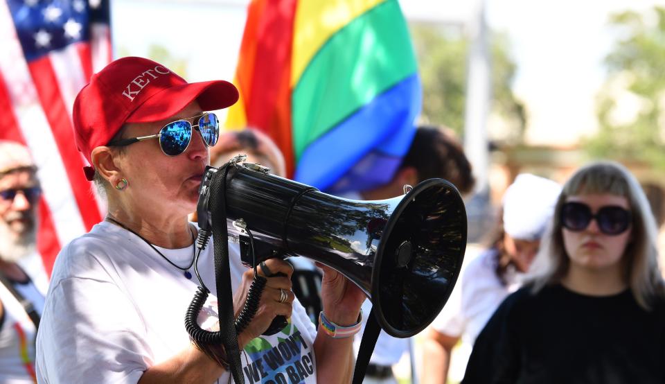 Shelley Rodden, a former teacher at Eau Gallie High, addresses the crowd during the Fourth of July protest in Viera.