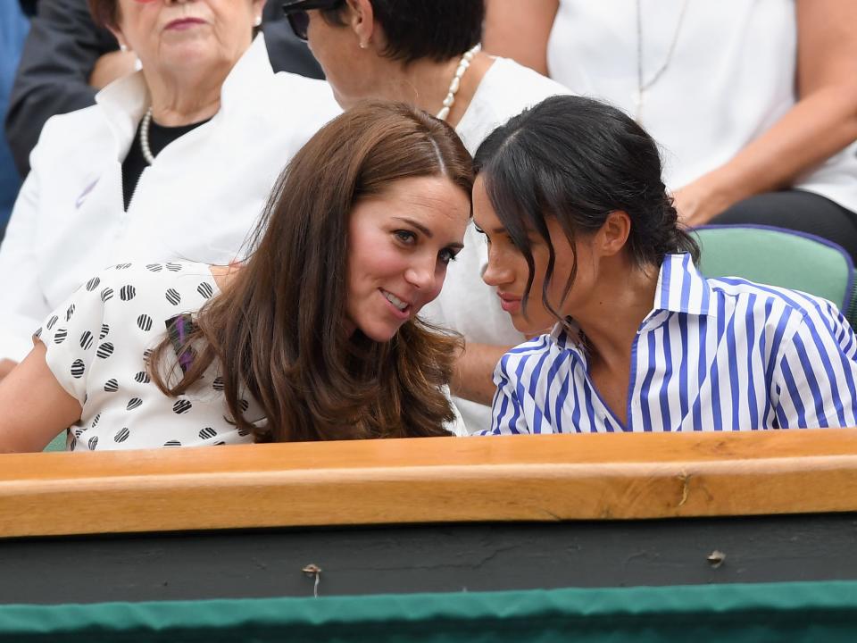 Catherine, Duchess of Cambridge and Meghan, Duchess of Sussex attends day twelve of the Wimbledon Tennis Championships at the All England Lawn Tennis and Croquet Club on July 13, 2018 in London, England.