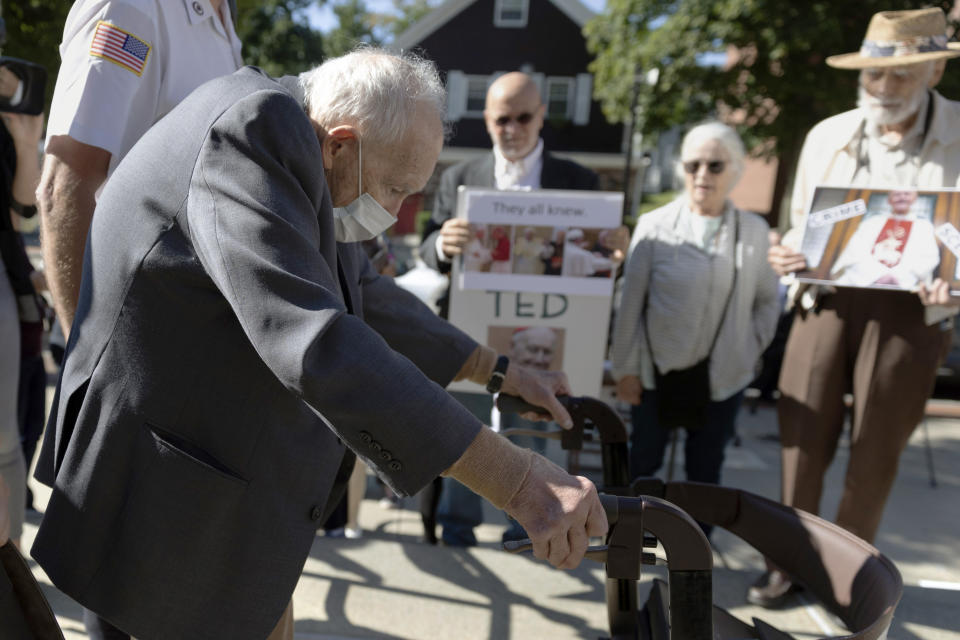 FILE - Demonstrators watch as former Cardinal Theodore McCarrick leaves Dedham District Court after his arraignment, Sept. 3, 2021, in Dedham, Mass. The defrocked Cardinal McCarrick, the highest ranking Roman Catholic official in the United States to face criminal charges in the clergy sexual abuse scandal, was found not competent to stand trial Wednesday, Aug. 30, 2023. (AP Photo/Michael Dwyer, File)