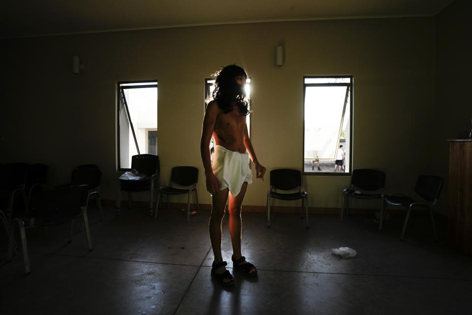 Daniel Hernandez prepares for his role as Jesus Christ in a Way of the Cross reenactment, as part of Holy Week celebrations, in Colina, Chile, Friday, March 29, 2024. Holy Week commemorates the last week of Jesus' earthly life which culminates with his crucifixion on Good Friday and his resurrection on Easter Sunday. (AP Photo/Esteban Felix)