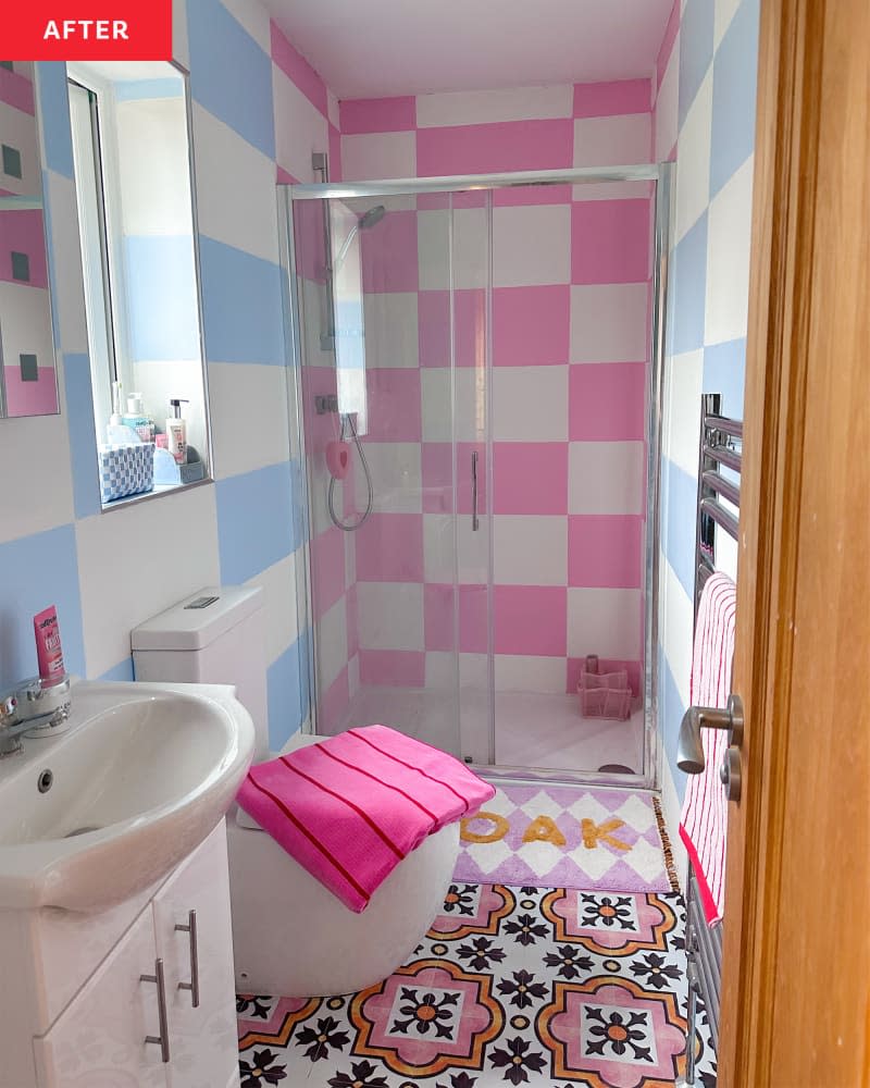 A renovated bathroom with blue, pink, and white tiled walls.