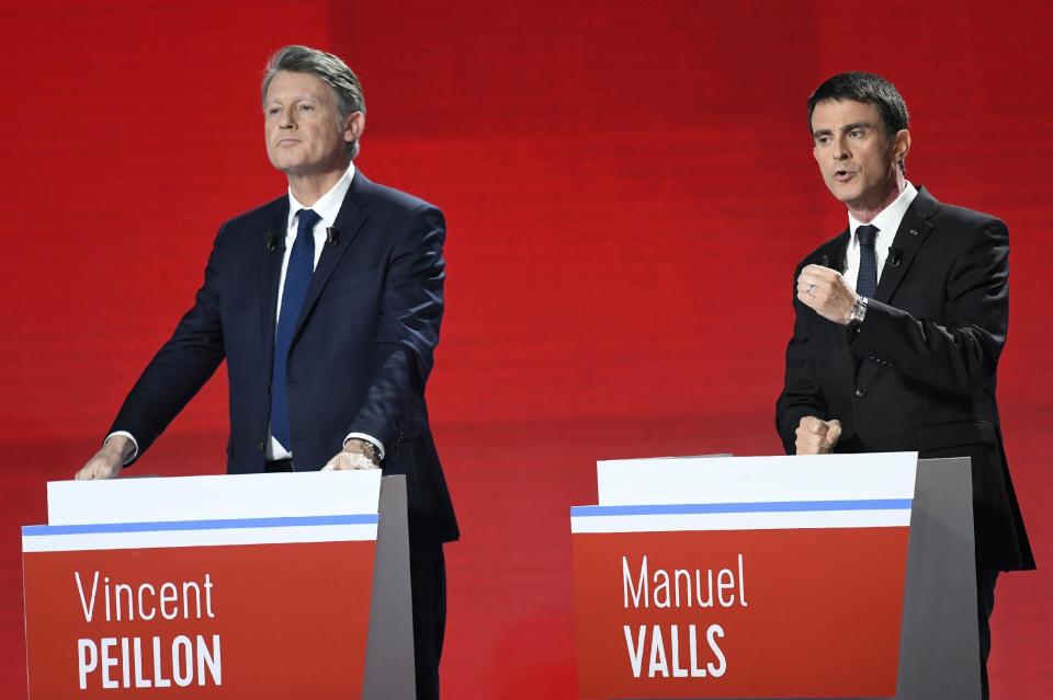 Candidates for the French left's presidential primaries ahead of the 2017 presidential election, Vincent Peillon, left, and Manuel Valls take part in the second televised debate in Paris, France, Sunday, Jan. 15, 2016. Seven competitors are bidding to be the Socialist Party's candidate in next spring's French presidential election. (Bertrand Guay/Pool Photo via AP)