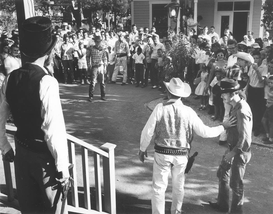 November 1961: Audience watching a Western themed act depicting a shoot-out at Six Flags Over Texas.