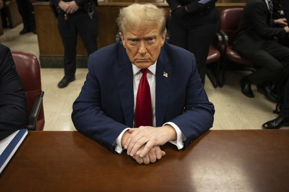 Former President Donald Trump waits for the start of proceedings in Manhattan criminal court, Tuesday, April 23, 2024, in New York. Before testimony resumes Tuesday, the judge will hold a hearing on prosecutors' request to sanction and fine Trump over social media posts they say violate a gag order prohibiting him from attacking key witnesses. (AP Photo/Yuki Iwamura, Pool)